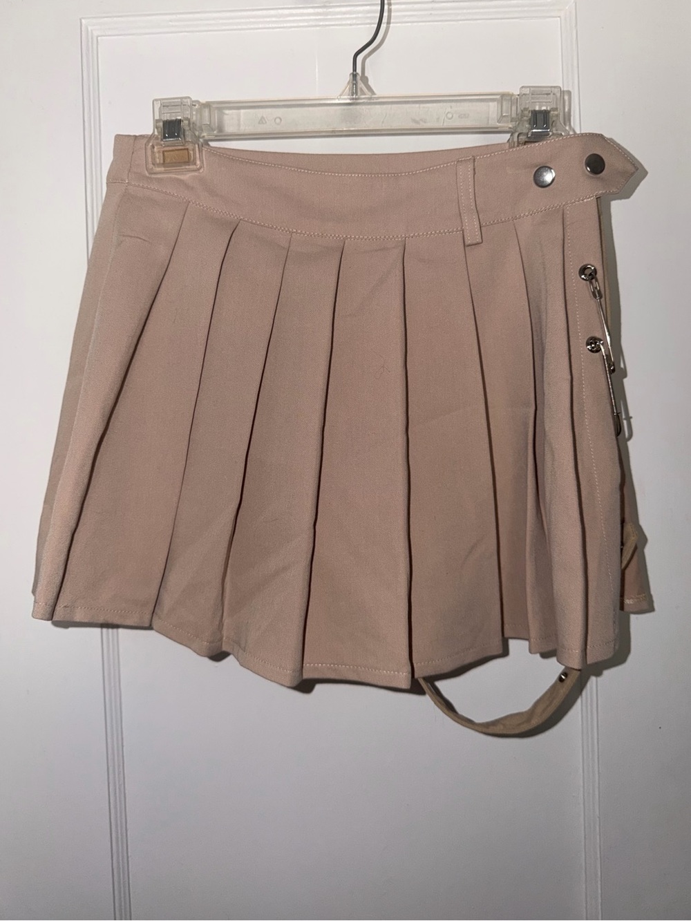 Lychee Pleated Mini Skirt With Adjustable Garter Strap in Tan